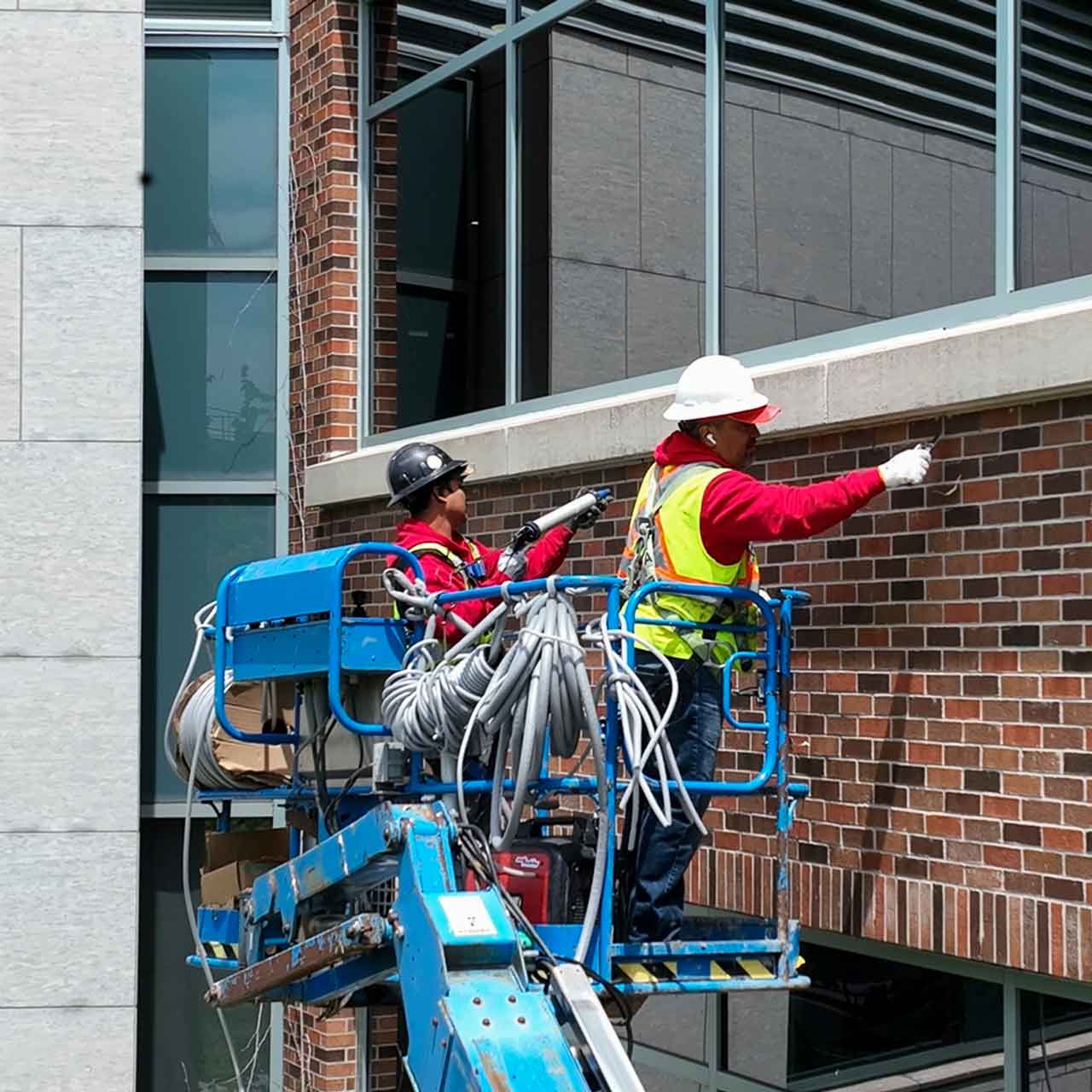 Costa Caulking technician applying exterior caulking sealant on a high-rise project in Toronto